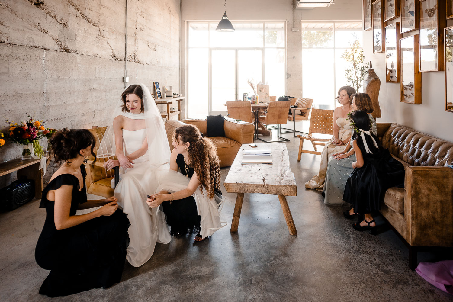 Ice Plant Bldg Wedding | La Grange | Zoe+Patrick 15 Bride surrounded by bridesmaids preparing.