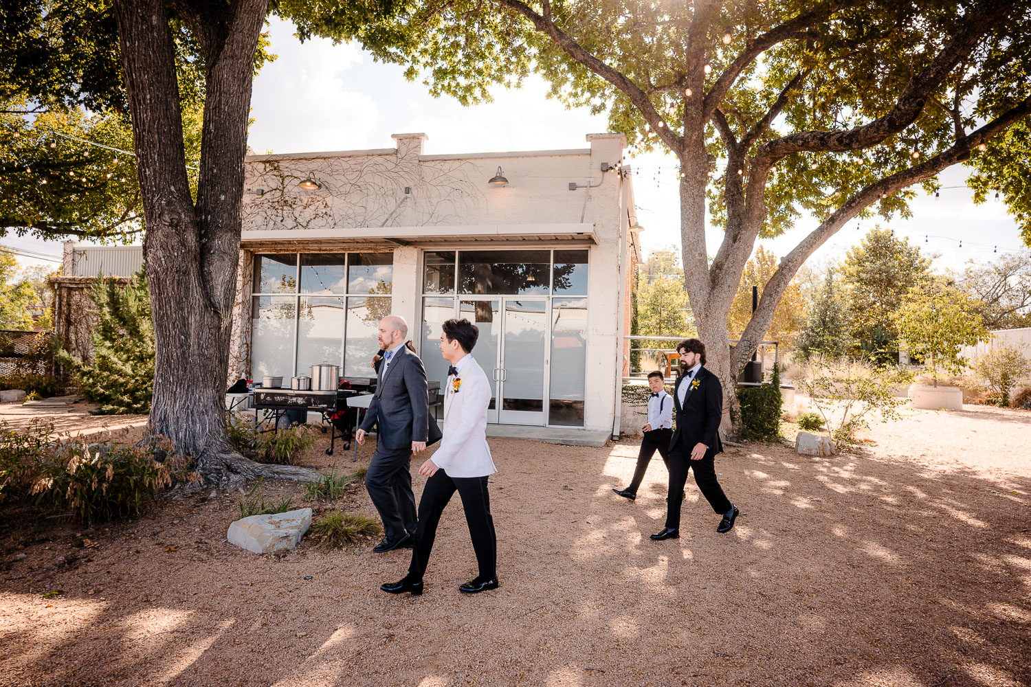 Ice Plant Bldg Wedding | La Grange | Zoe+Patrick 19 Group walking towards a venue.