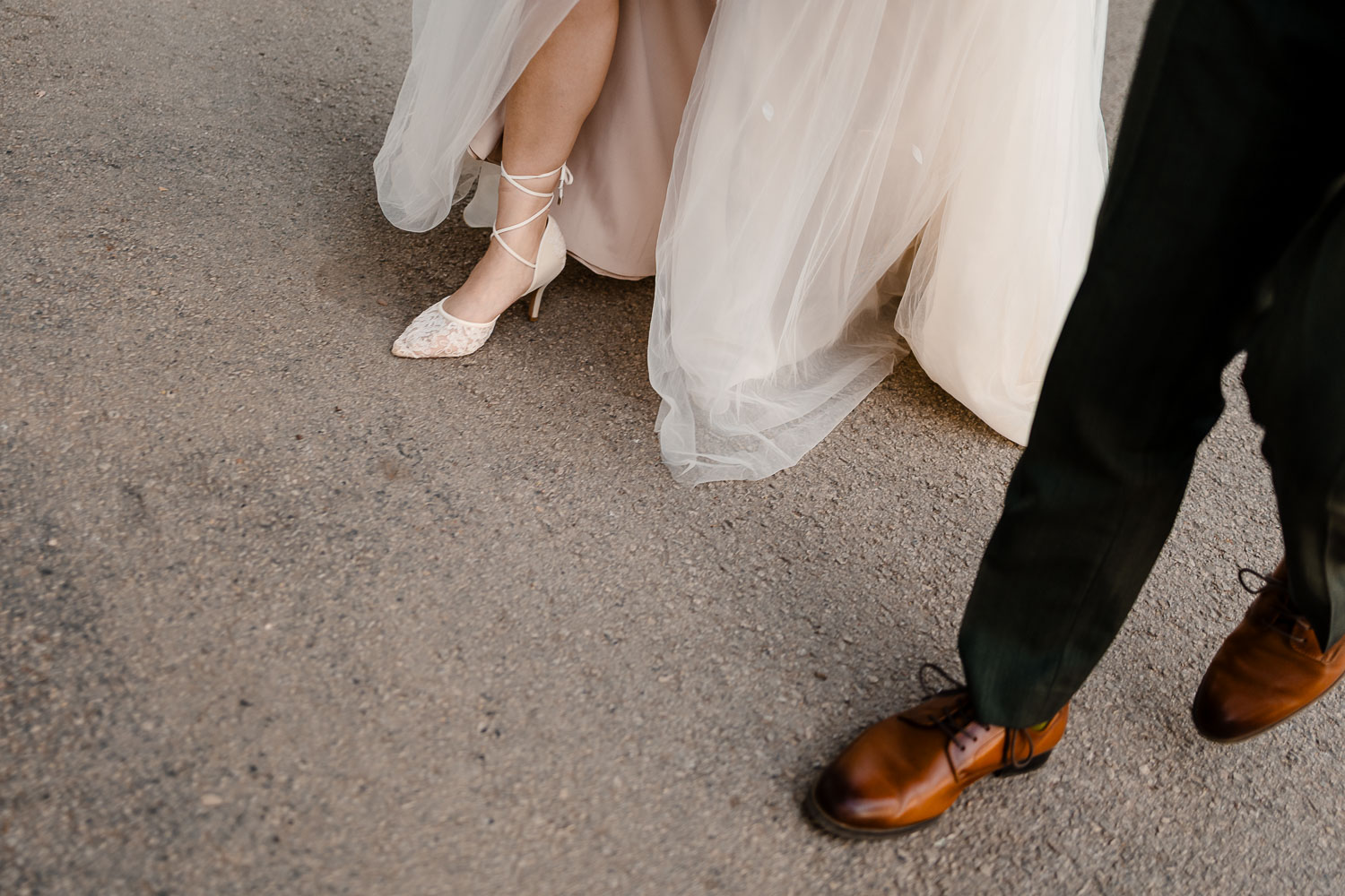 Bride's shoe and groom's shoe