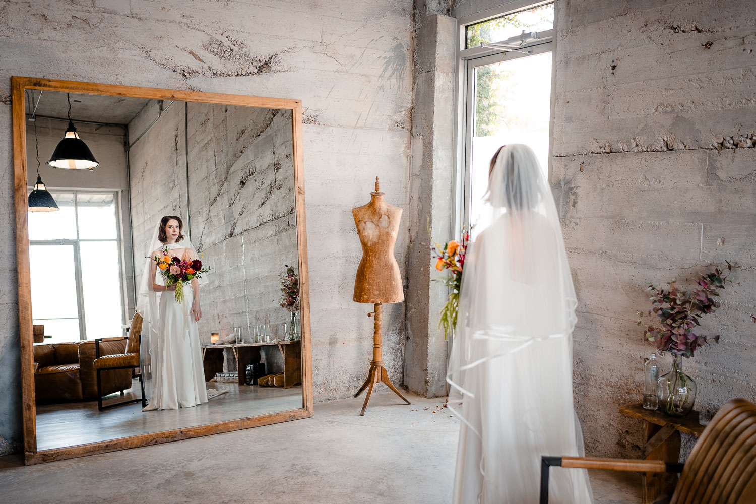Ice Plant Bldg Wedding | La Grange | Zoe+Patrick 22 Bride admiring herself in mirror.