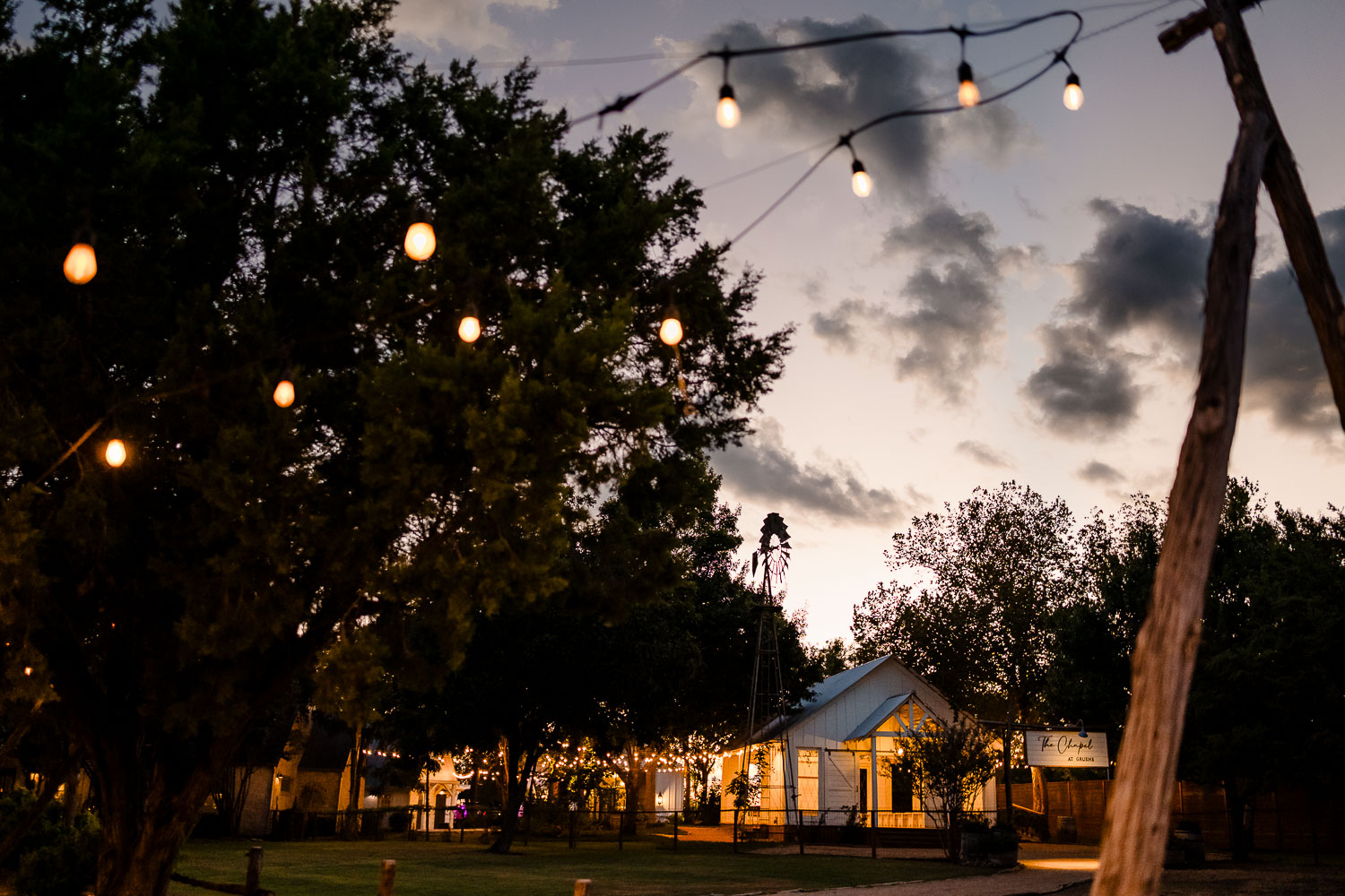 Charming outdoor venue with string lights.