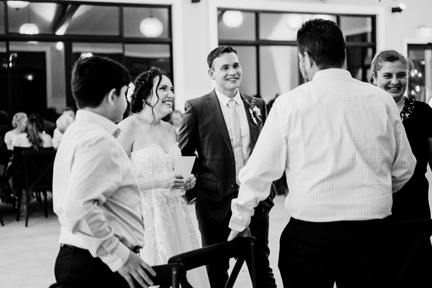 Wedding reception with guests interacting.