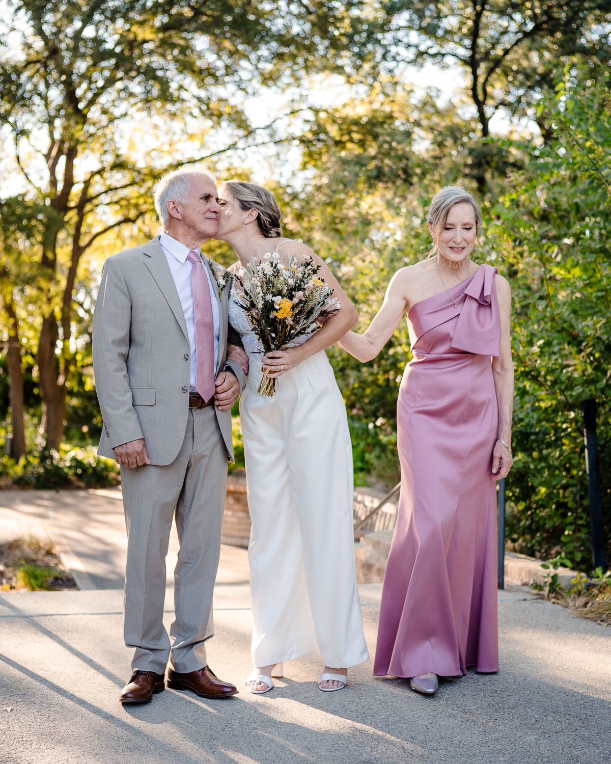 Botanical Gardens San Antonio Wedding Ceremony + Reception 26 Couple sharing a romantic moment outdoors.