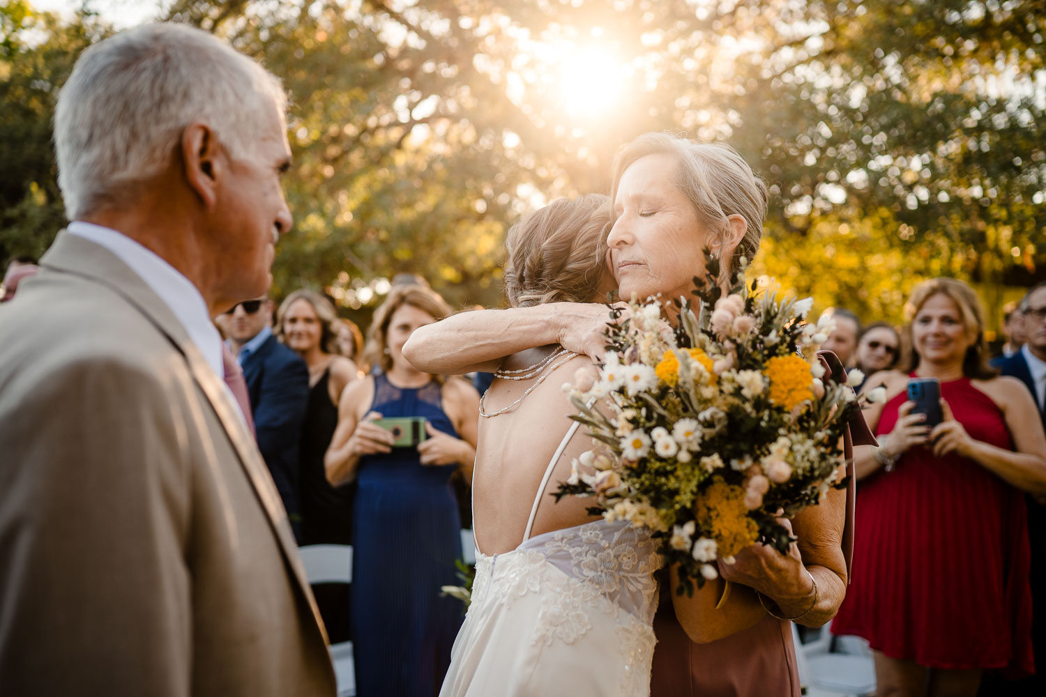 Botanical Gardens San Antonio Wedding Ceremony + Reception 27 Emotional embrace during wedding ceremony.