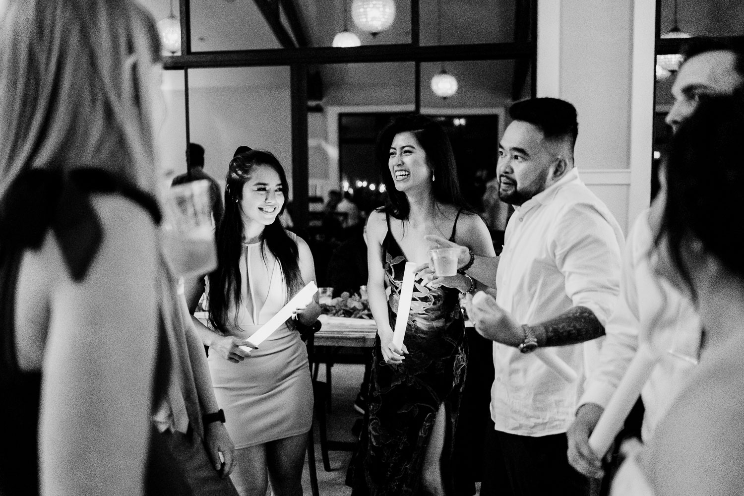 Social gathering with drinks and laughter.