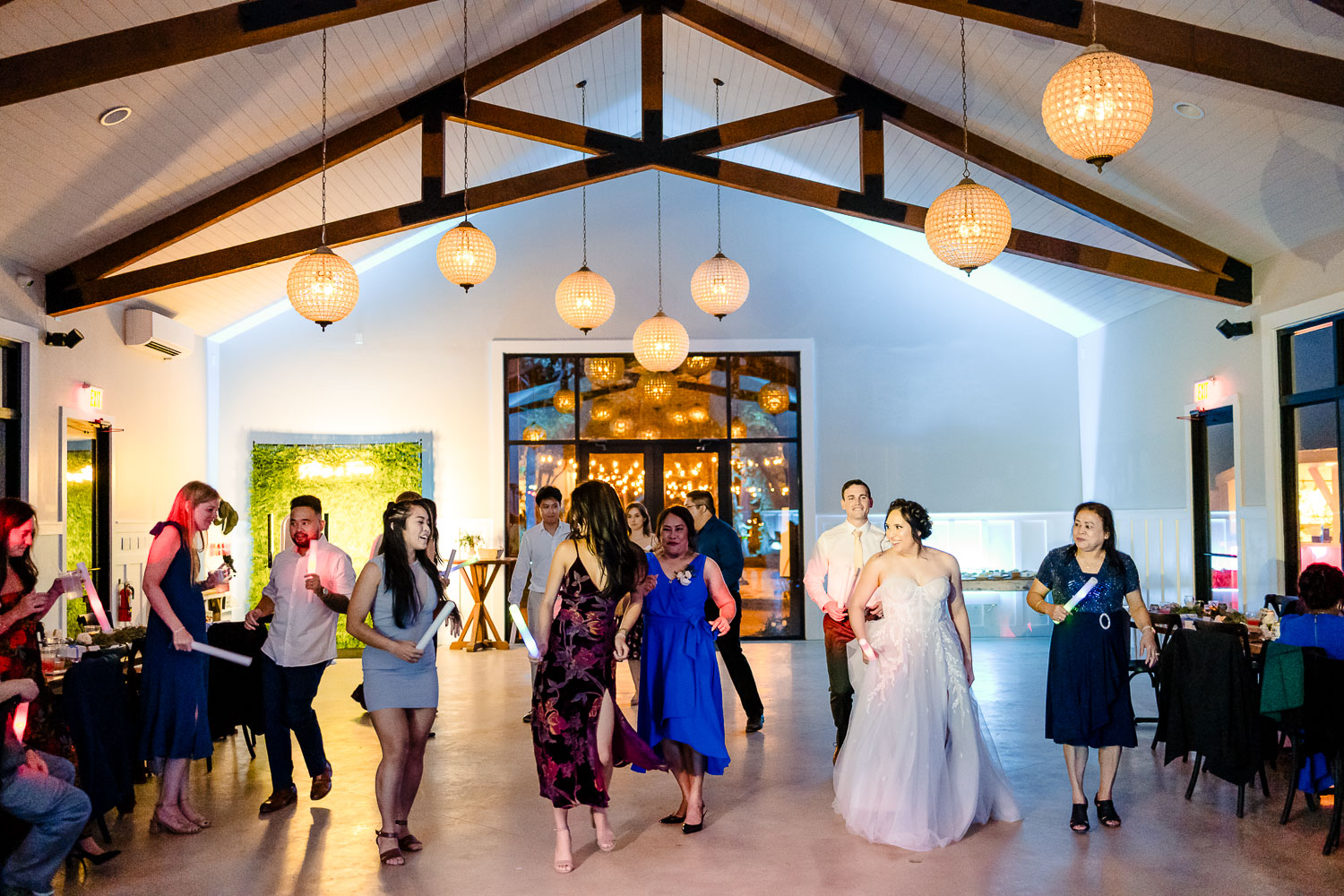 Wedding reception with dancing guests.
