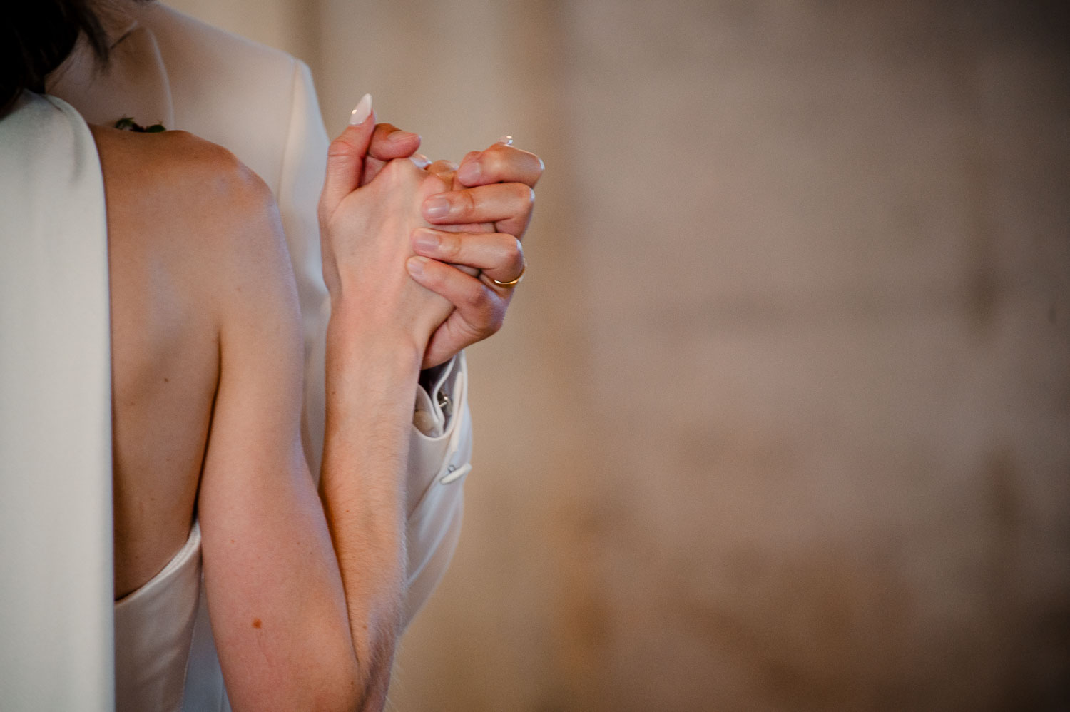 Ice Plant Bldg Wedding | La Grange | Zoe+Patrick 45 Couple walking hand in hand outdoors.