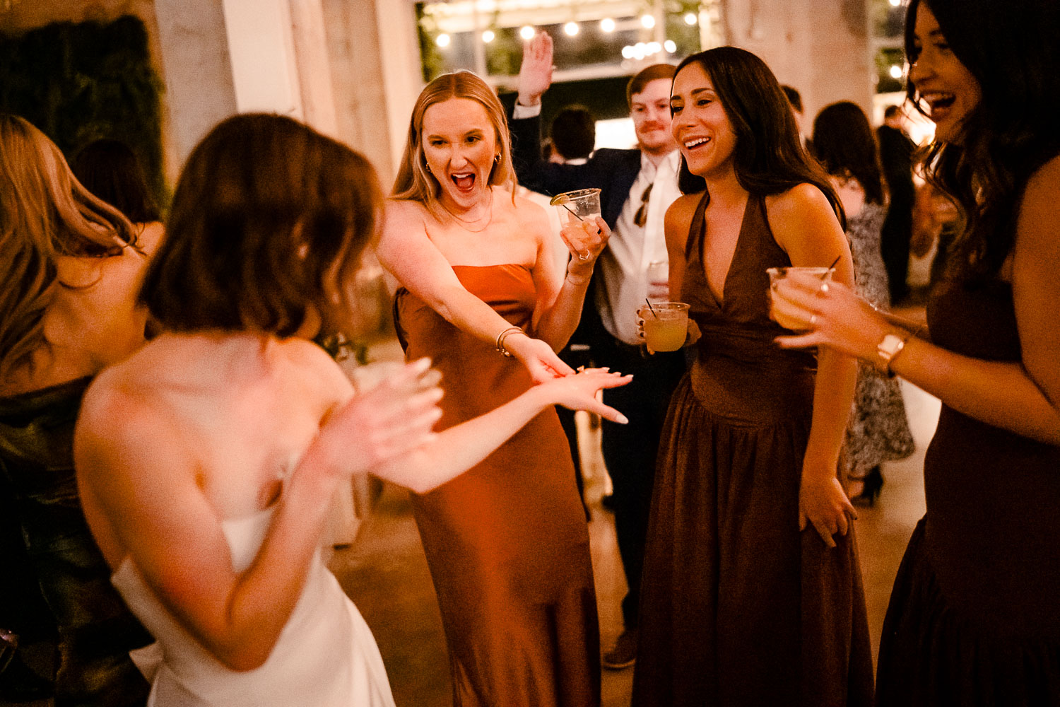 Ice Plant Bldg Wedding | La Grange | Zoe+Patrick 58 Women celebrating at a wedding reception.