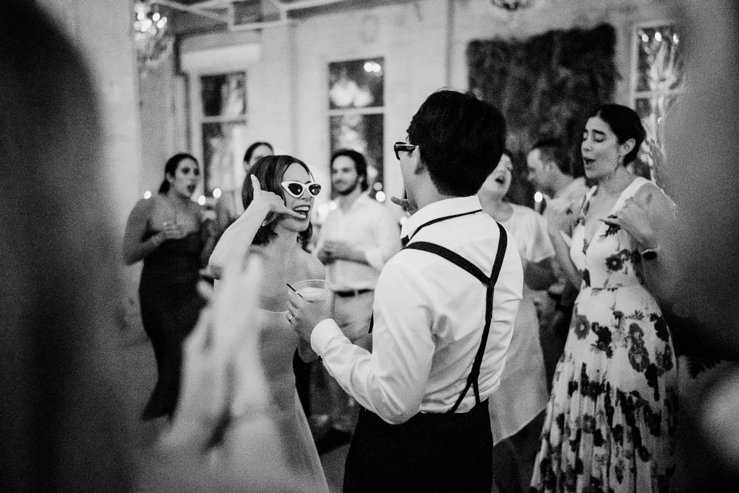 Ice Plant Bldg Wedding | La Grange | Zoe+Patrick 68 Two men conversing at candlelit table.