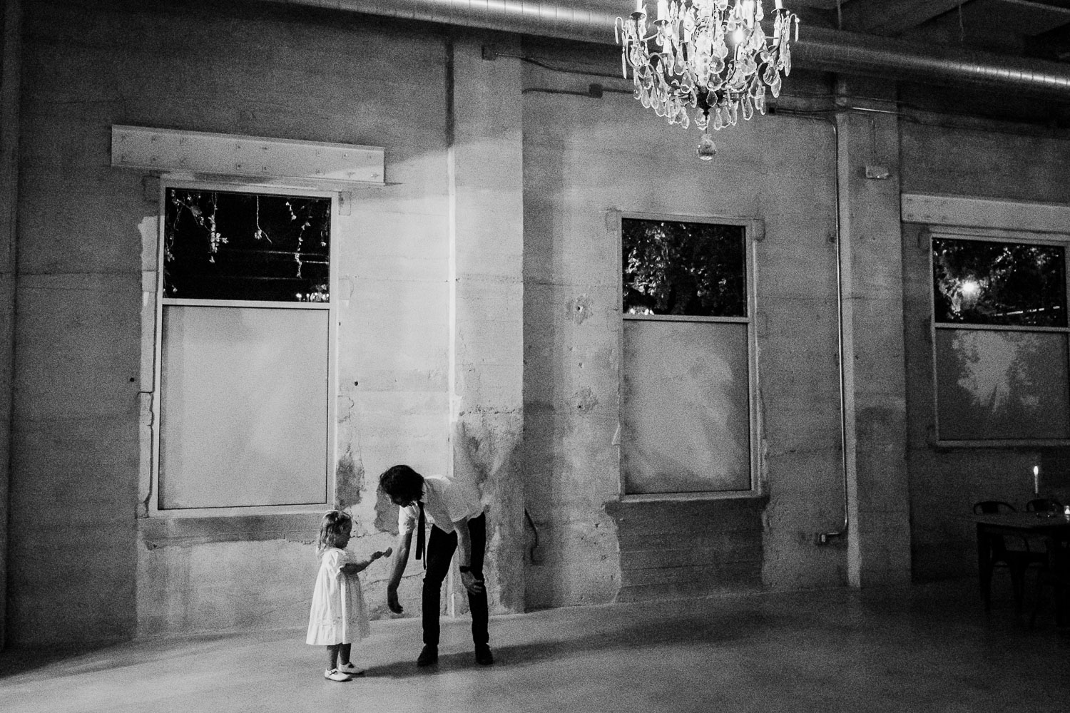 Wedding reception with guests celebrating joyfully.