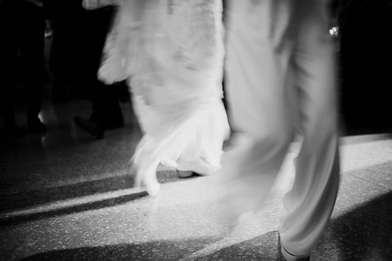 Couple dancing in elegant attire.