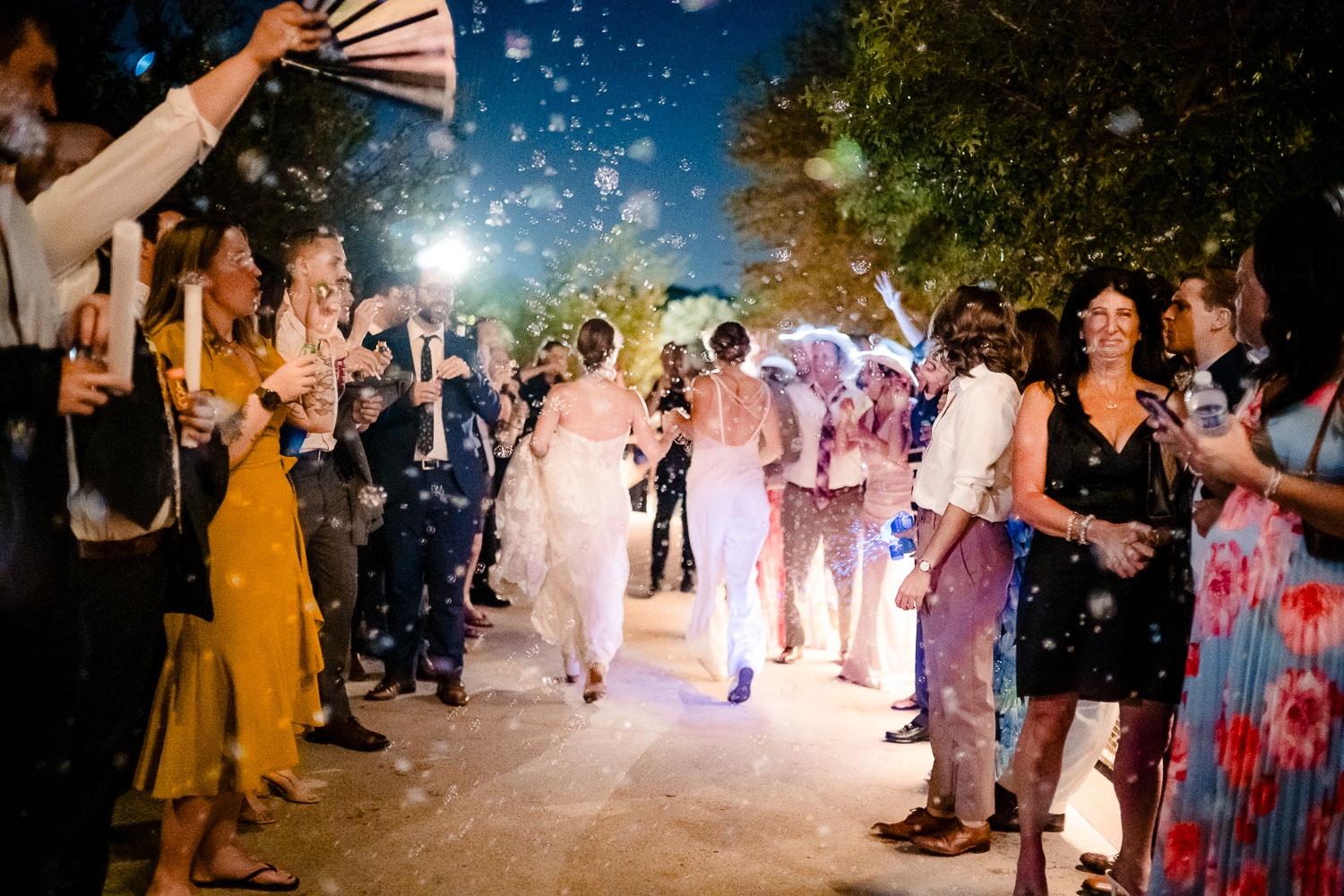 Botanical Gardens San Antonio Wedding Ceremony + Reception 74 Couple exits amidst bubbles and celebration.