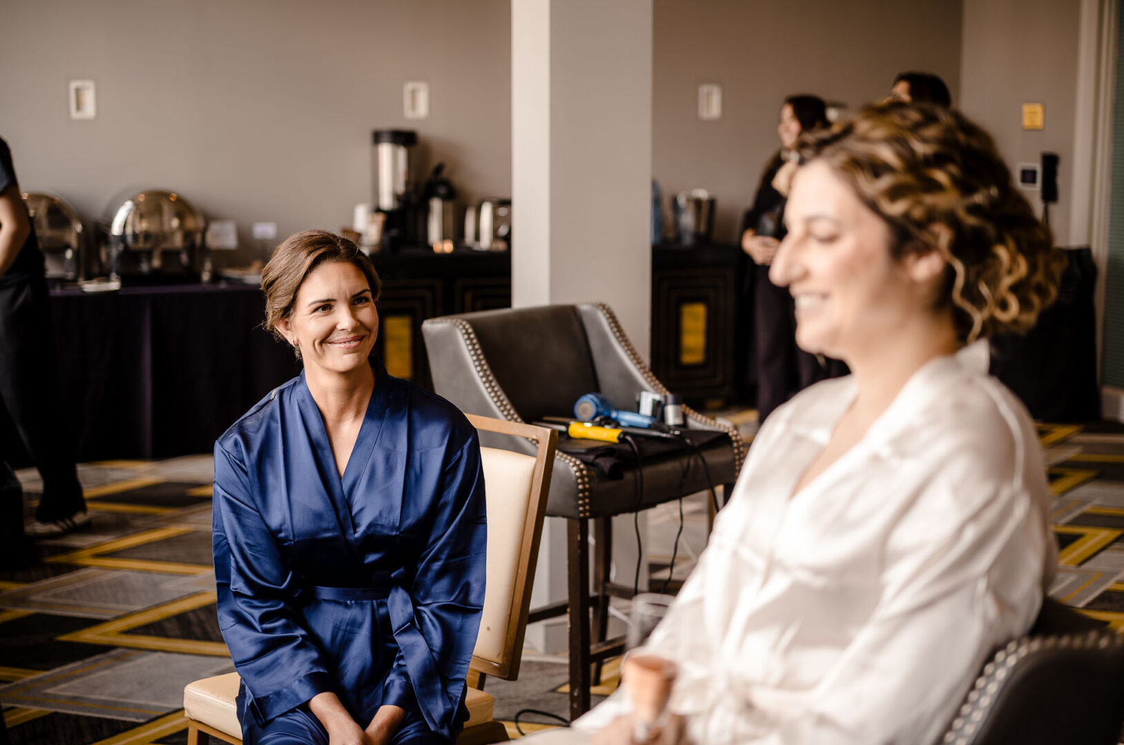 Bridesmaids preparing for wedding ceremony.