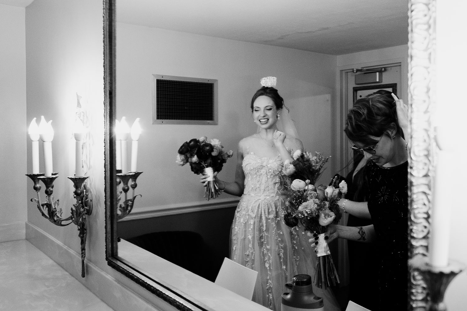 Margarite B. Parker Chapel Wedding Ceremony | Natalie + Jonathan | San Antonio 16 Bride preparing with bouquet in mirror.