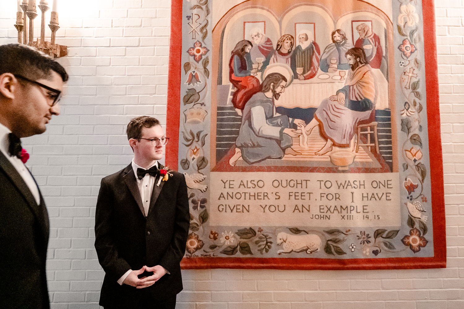 Margarite B. Parker Chapel Wedding Ceremony | Natalie + Jonathan | San Antonio 17 Groom standing near decorative wall tapestry.