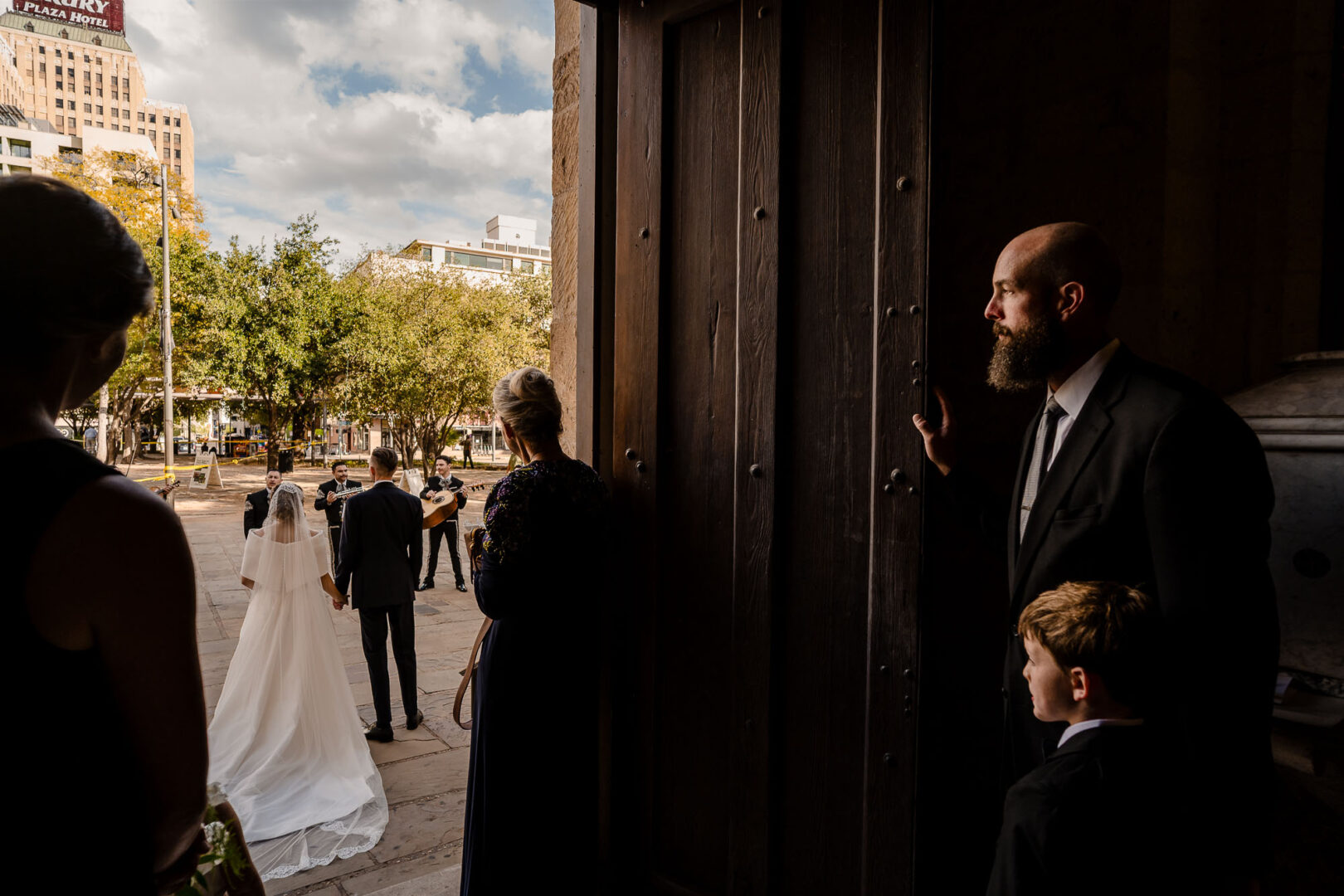 Wedding ceremony at cathedral entrance.