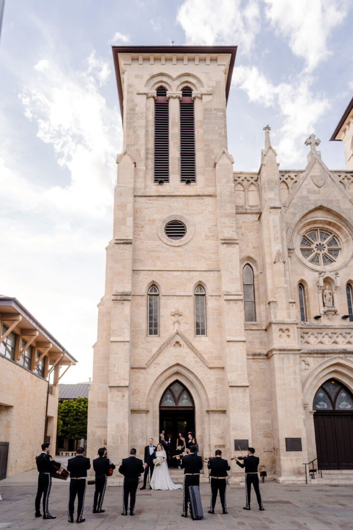 Wedding ceremony outside historic cathedral.
