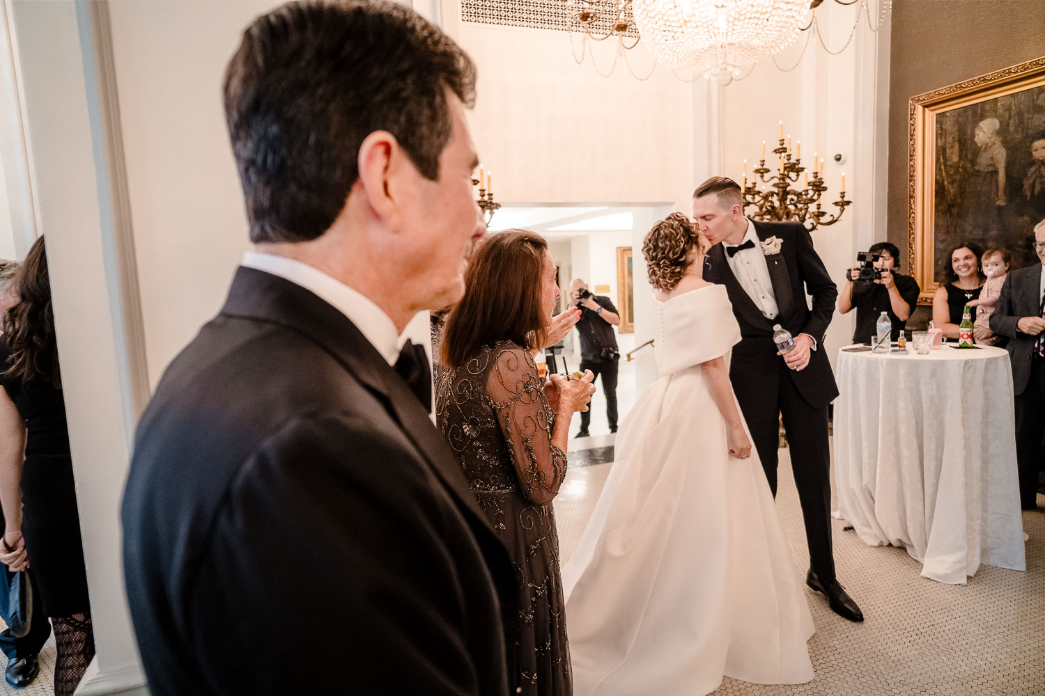 Elegant wedding reception with guests mingling.
