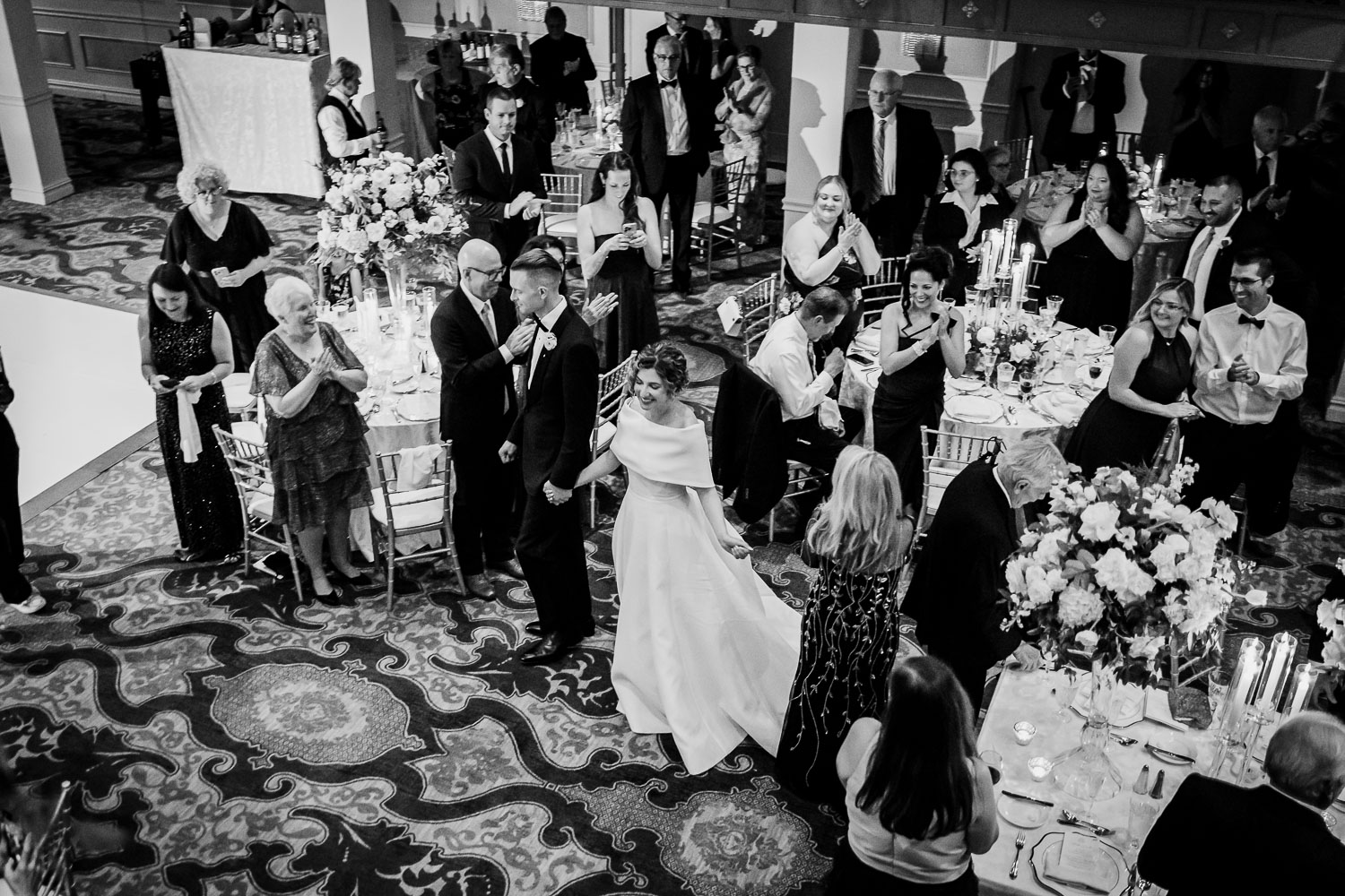 Elegant wedding reception with guests celebrating.