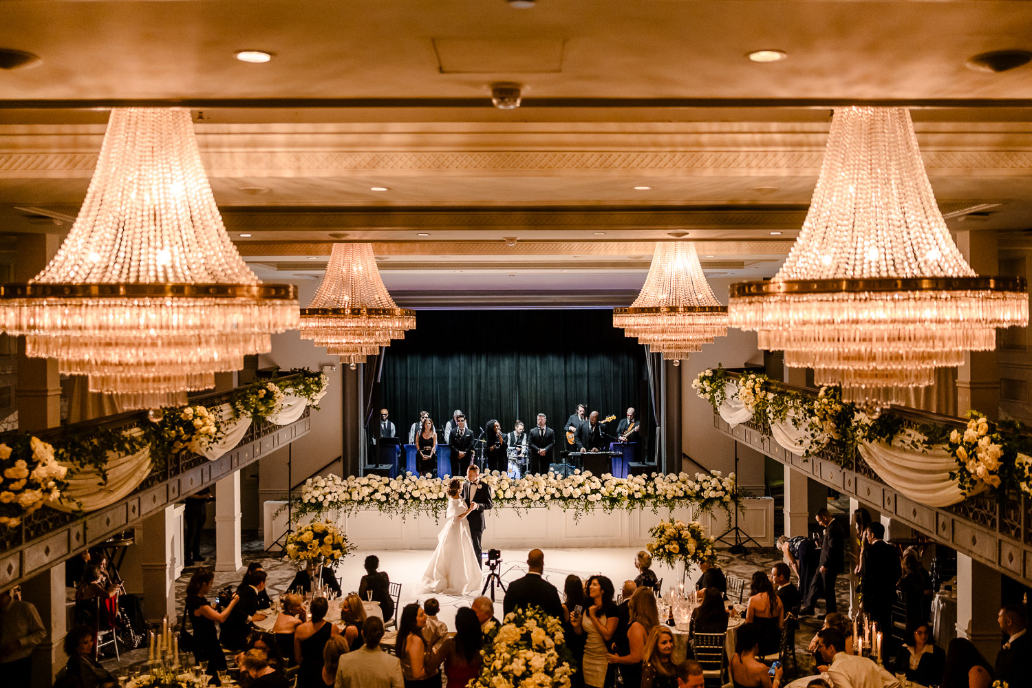 Elegant wedding ceremony with floral decorations.