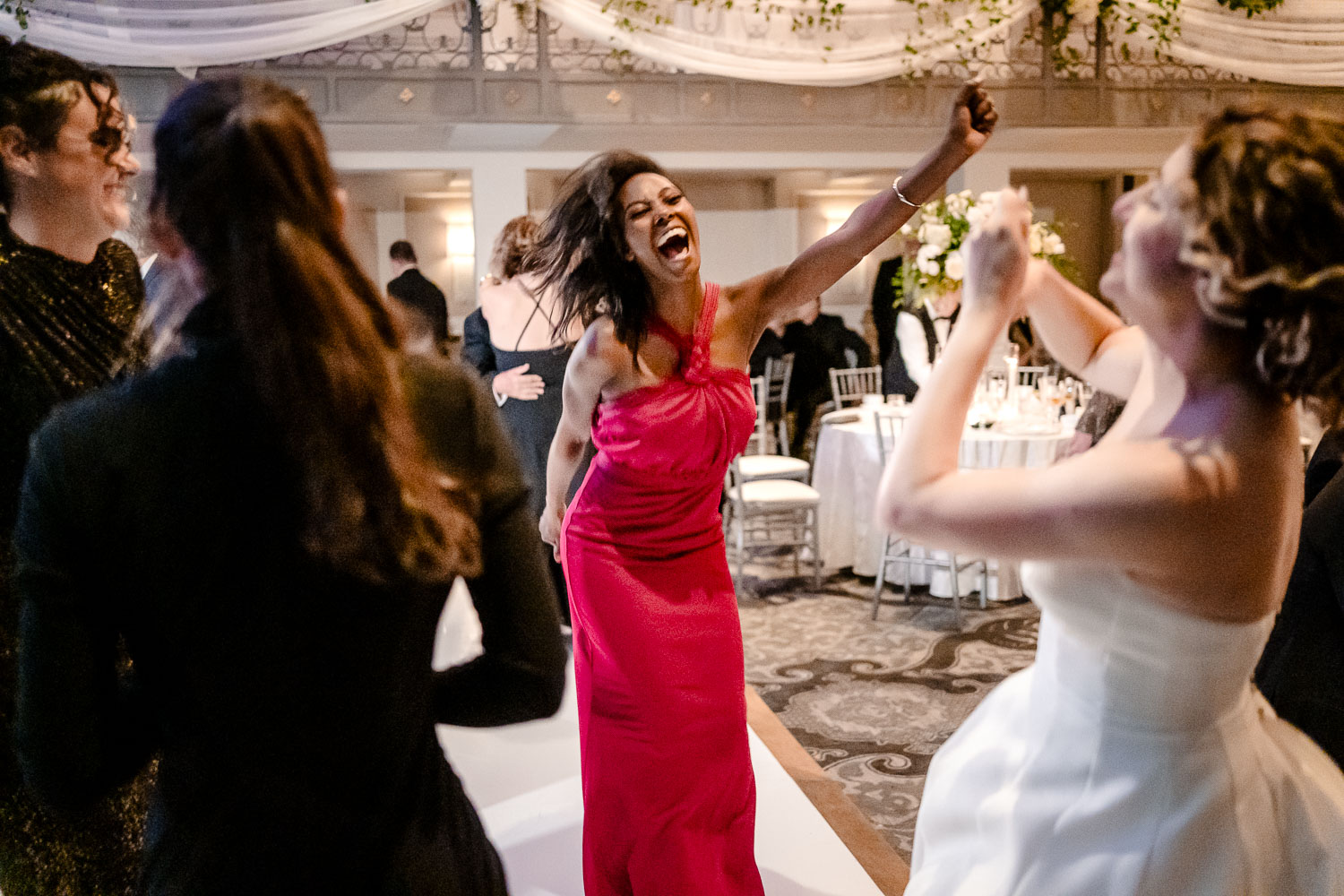 Guests dancing at wedding reception.