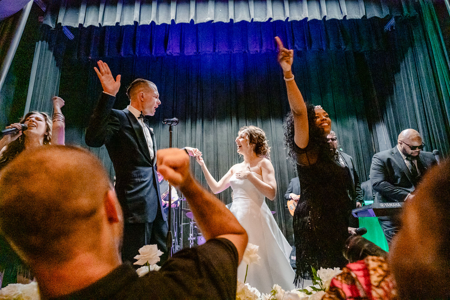 Celebration at wedding reception stage.