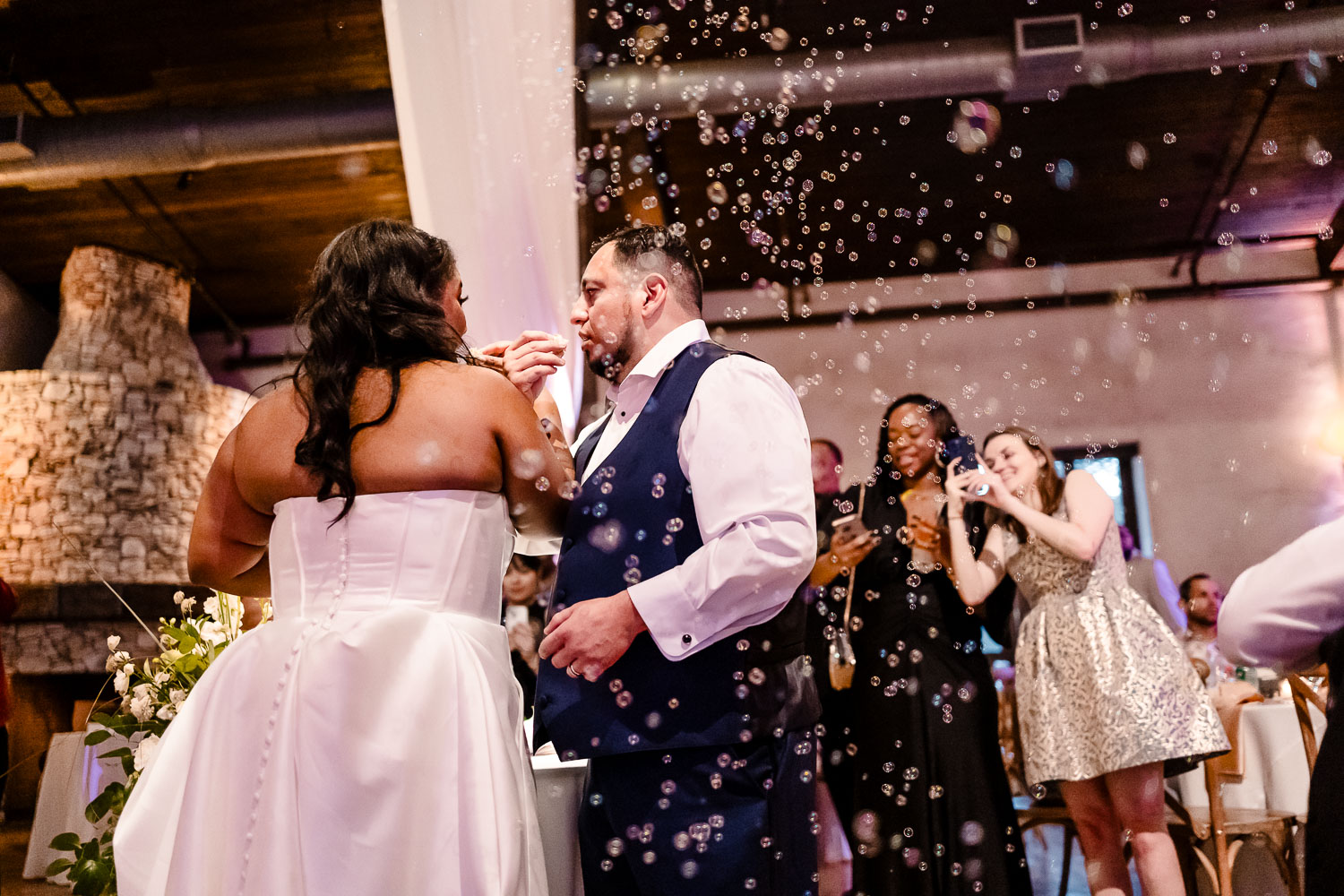 Lost Mission Wedding Ceremony + Reception | Peyge + Luis 48 Bubbles in shot as couple taste their wedding cake