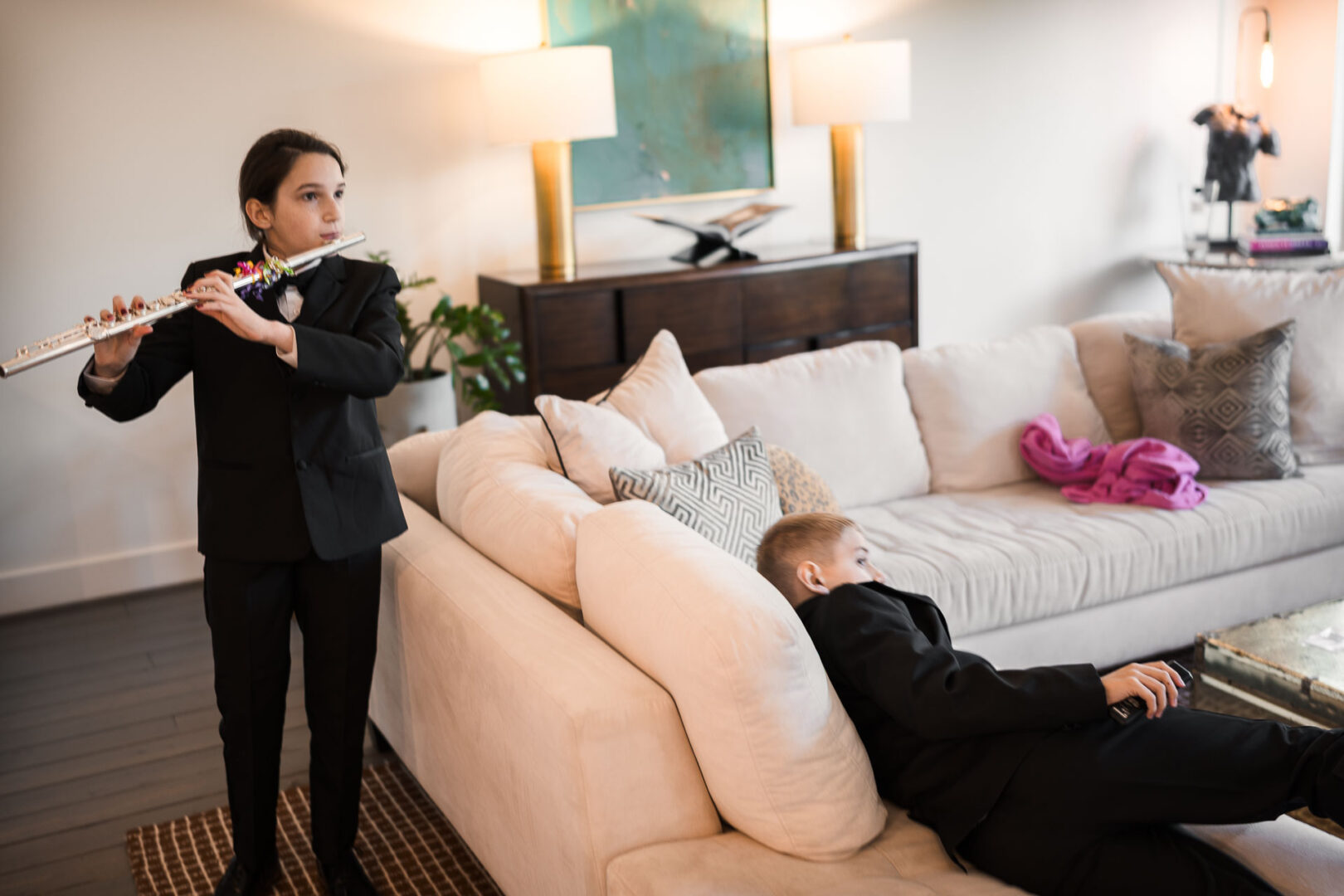 House + Backyard Wedding | Candace+Joey | Houston, TX 5 Child playing flute, another lounging.