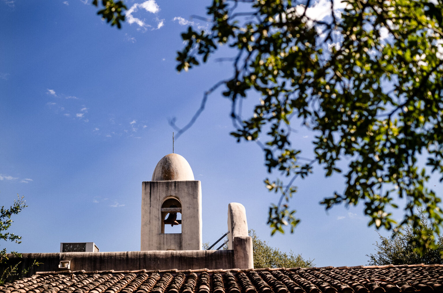 Bell tower against blue sky