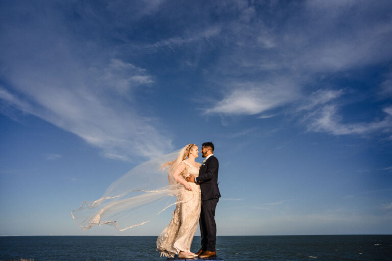 Wedding reception at Art Center of Corpus Christi; shows couple on beach front
