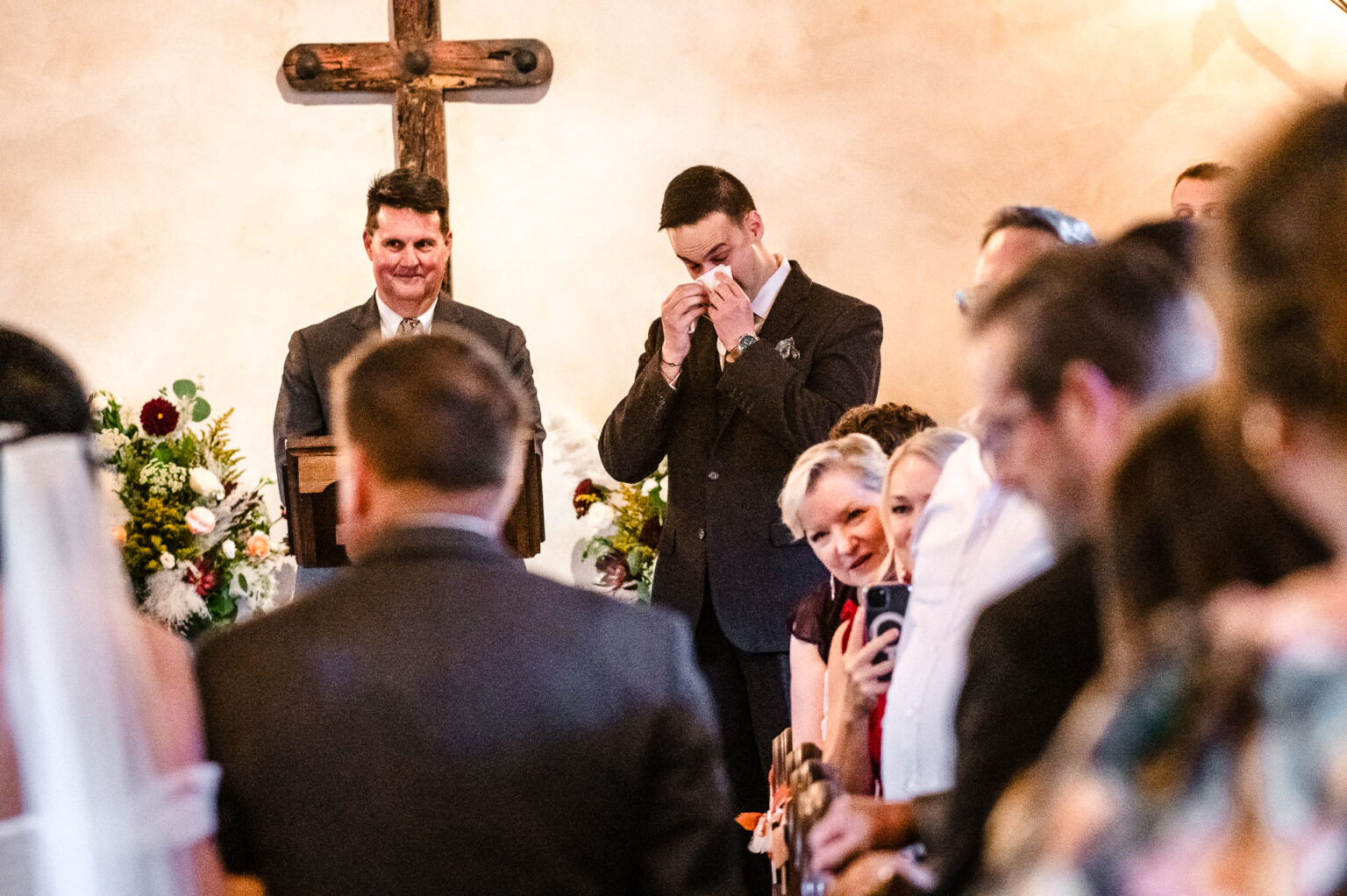 Wedding ceremony with attendees and decor.