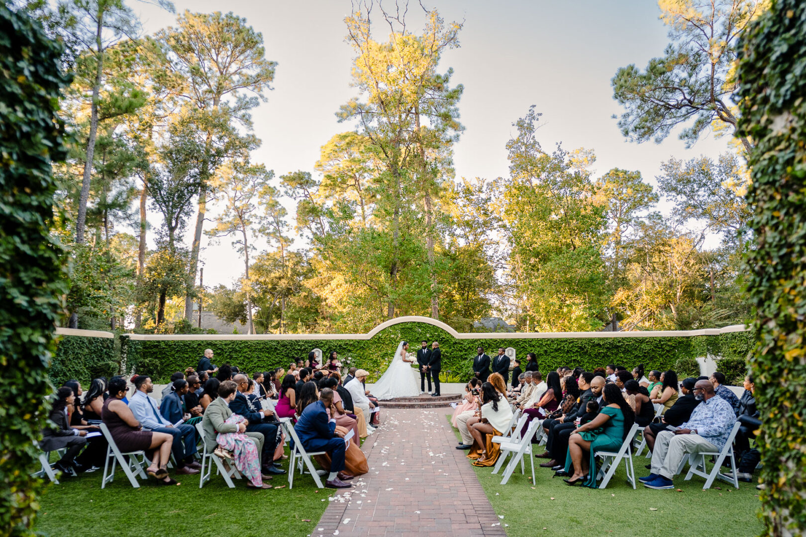 The Springs Weddings & Events | Candice + Larry 27 The Springs Houston Outdoor wedding ceremony with guests seated.