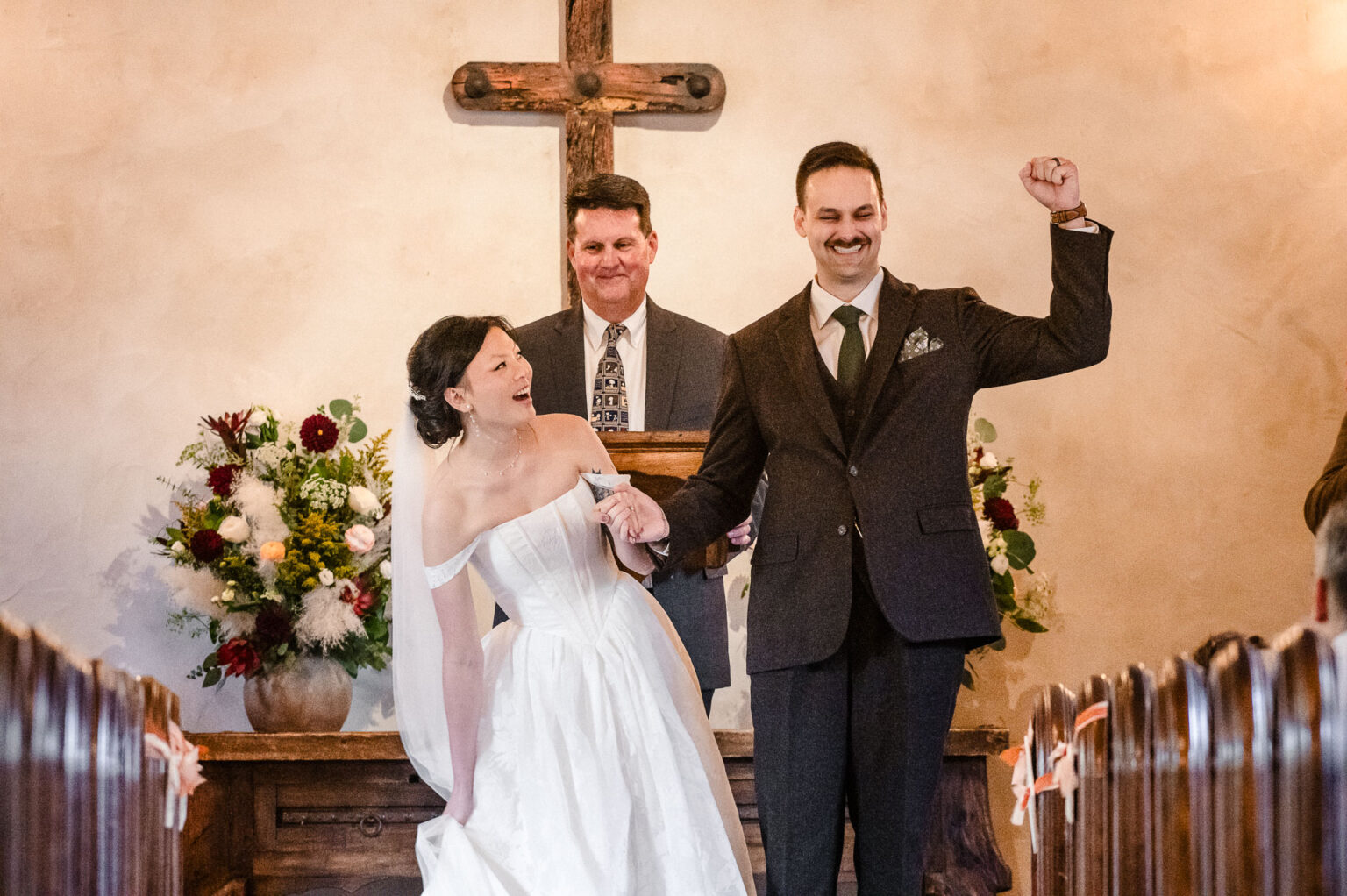 Couple celebrating wedding vows together.