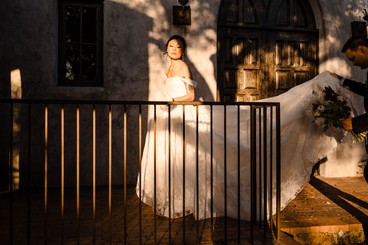 Bride walking with flowing wedding dress.