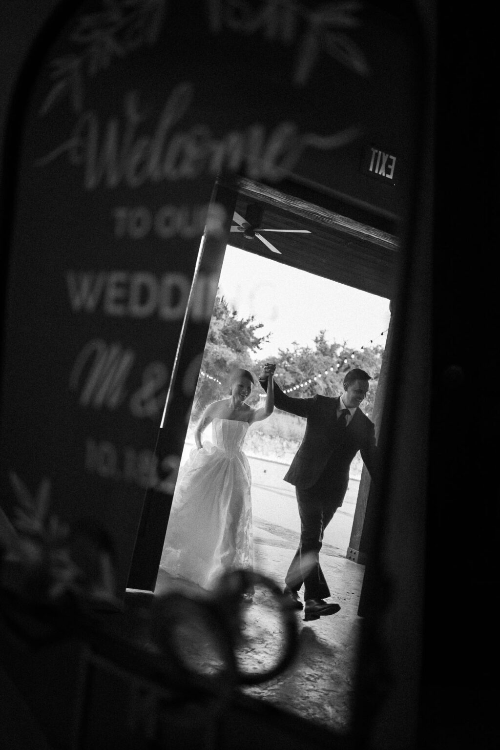 Couple dancing at wedding entrance.
