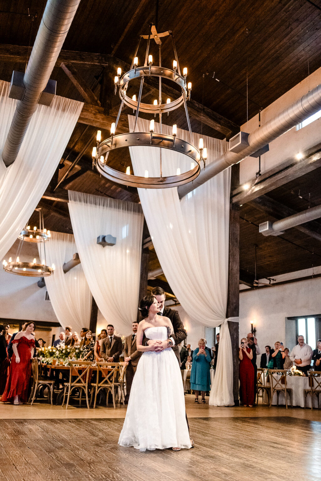 Elegant wedding reception with guests gathered.