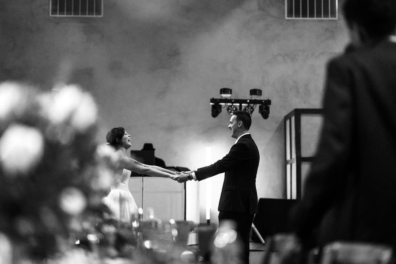 Couple holding hands during ceremony.