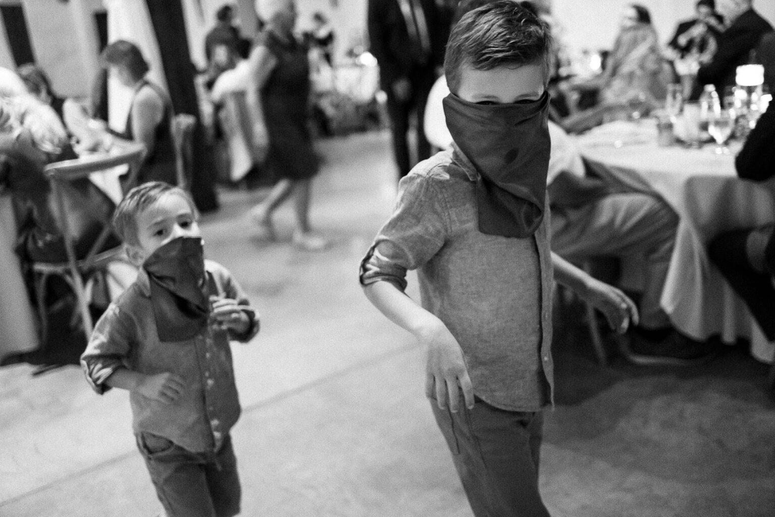 Two children running at a celebration.