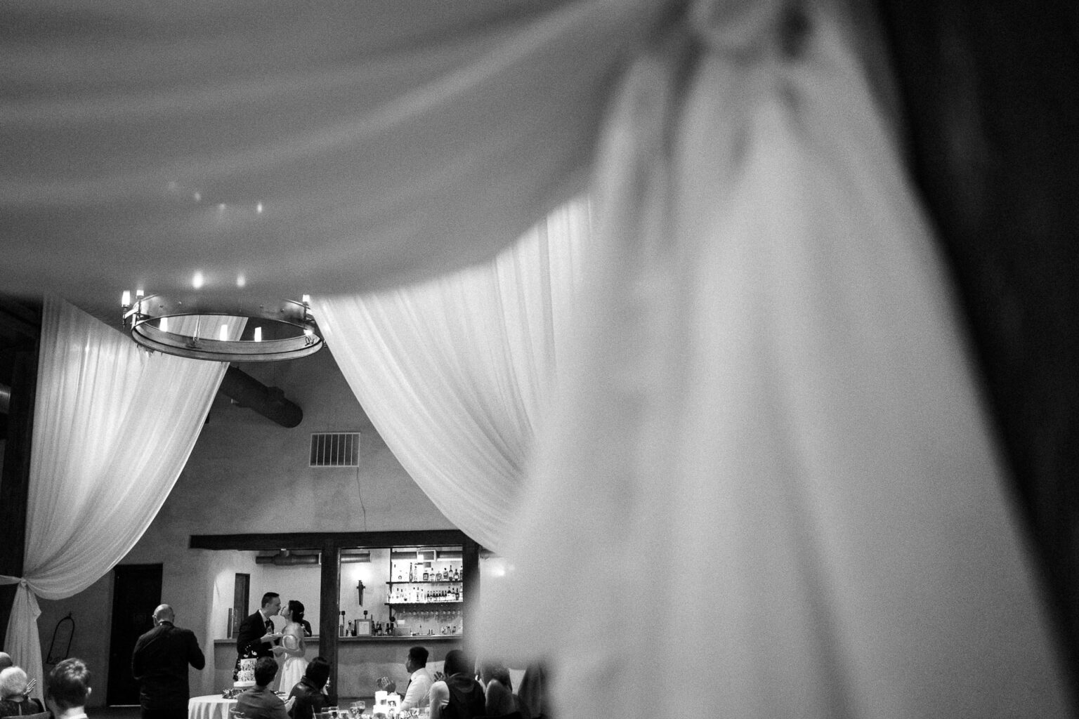 Elegant wedding reception with draped decor.