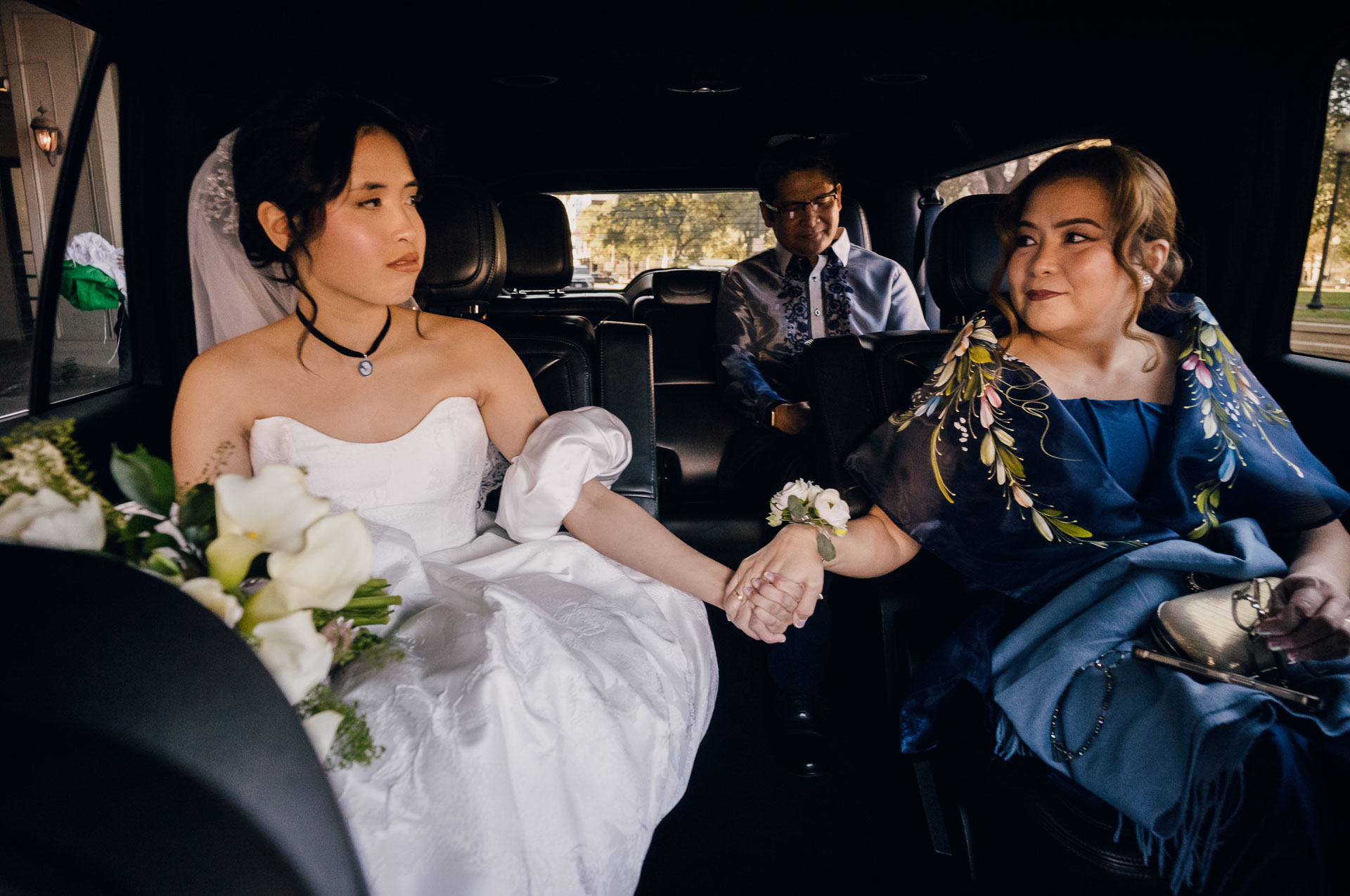 Bride holding hands with companion