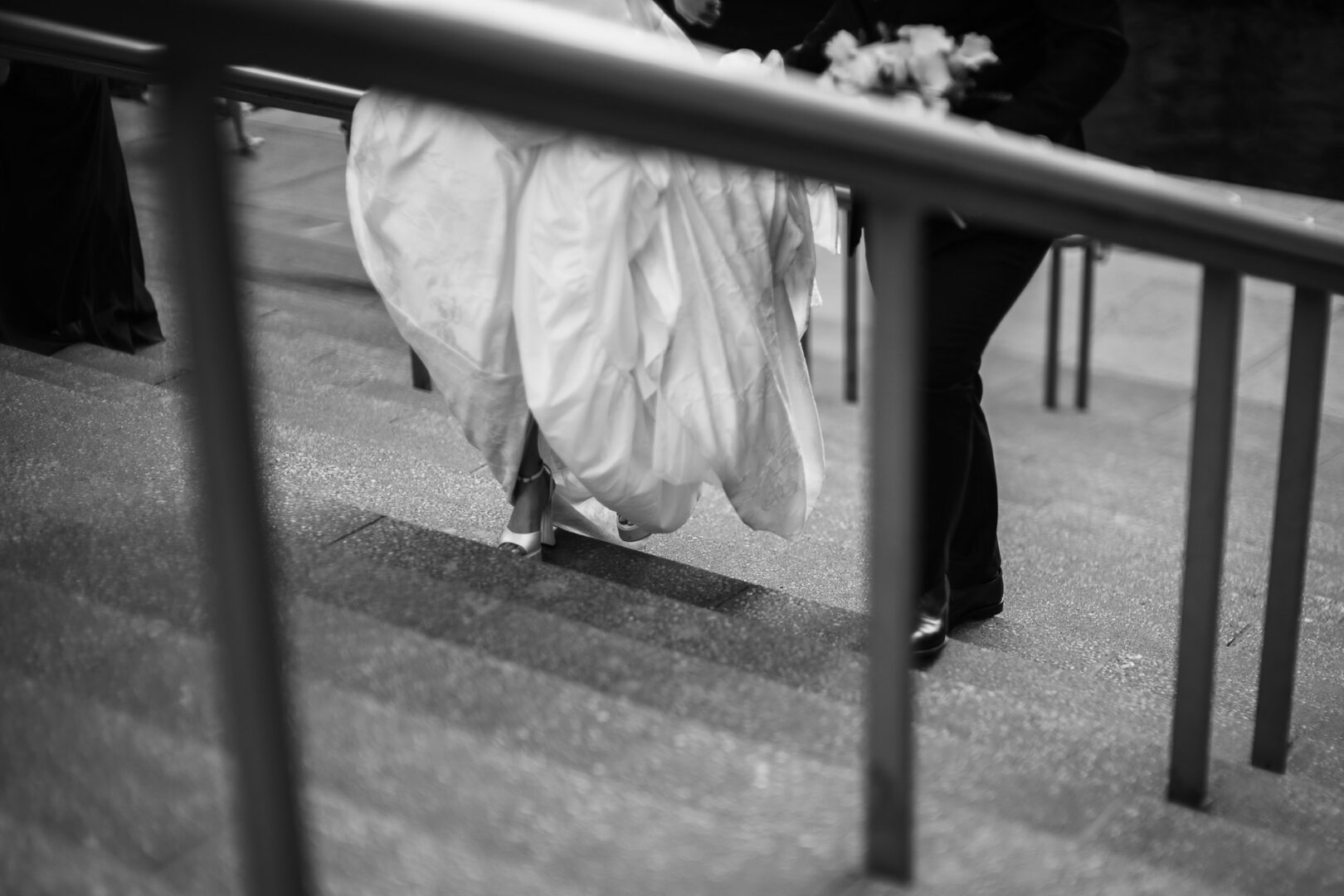 Noreena & Robert's Elegant Wedding at San Fernando Cathedral 38 Bride ascending stairs in wedding dress