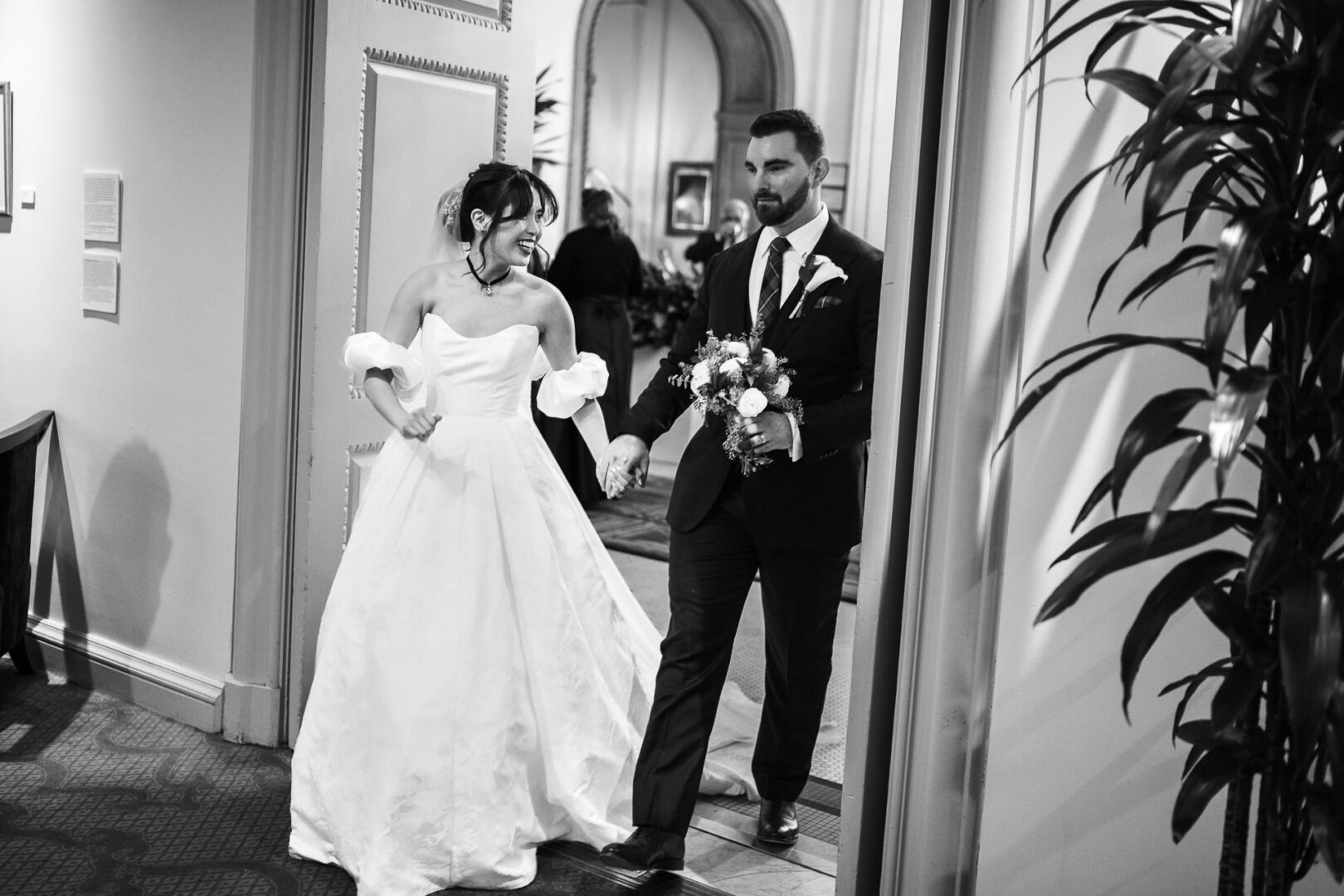 Noreena & Robert's Elegant Wedding at San Fernando Cathedral 47 Bride and groom entering reception venue.