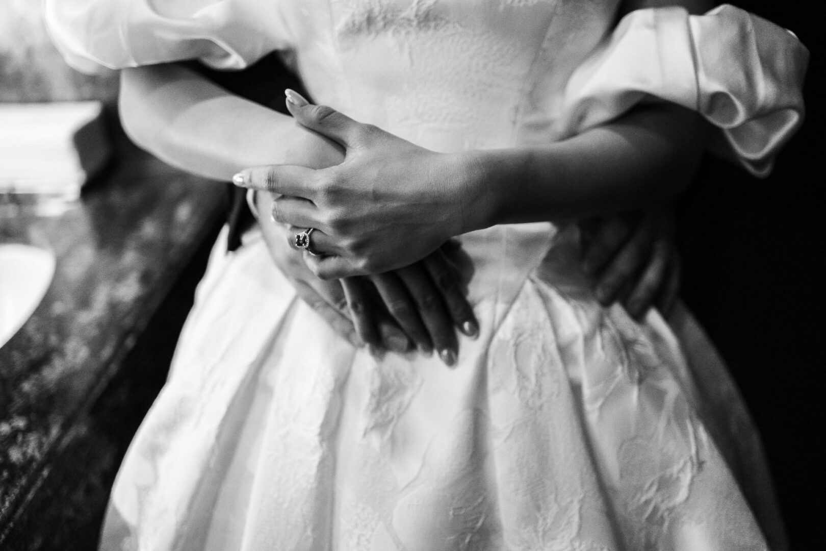 Noreena & Robert's Elegant Wedding at San Fernando Cathedral 42 Couple embracing in wedding attire.