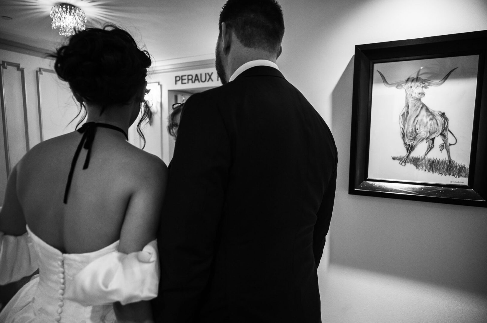 Noreena & Robert's Elegant Wedding at San Fernando Cathedral 46 Couple admiring artwork at event.