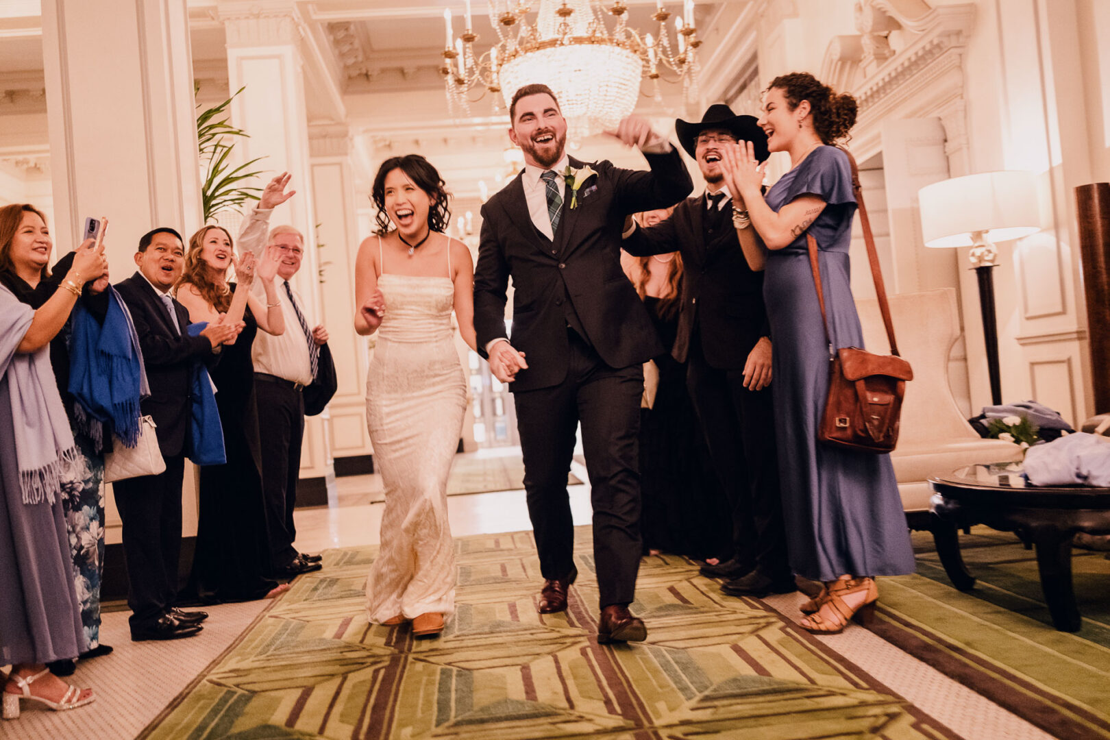 Noreena & Robert's Elegant Wedding at San Fernando Cathedral 68 Couple celebrating at a wedding reception.