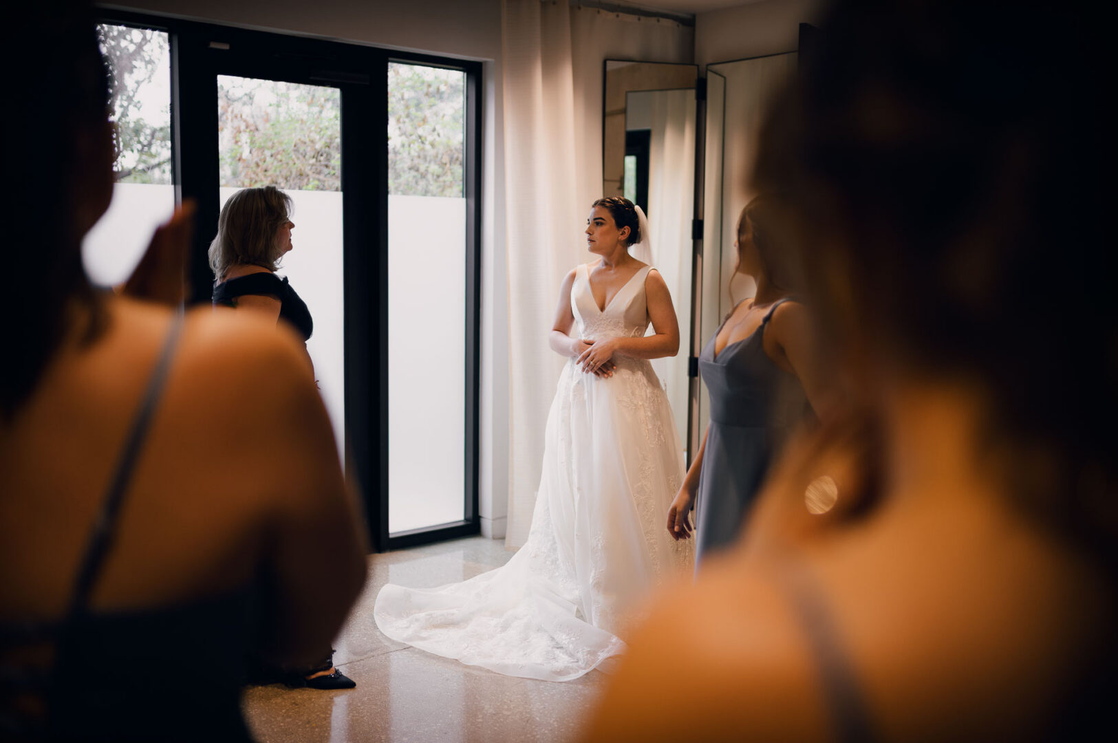 Winter Wedding at Botanical Gardens, San Antonio, Texas 7 Bride preparing with bridesmaids nearby.