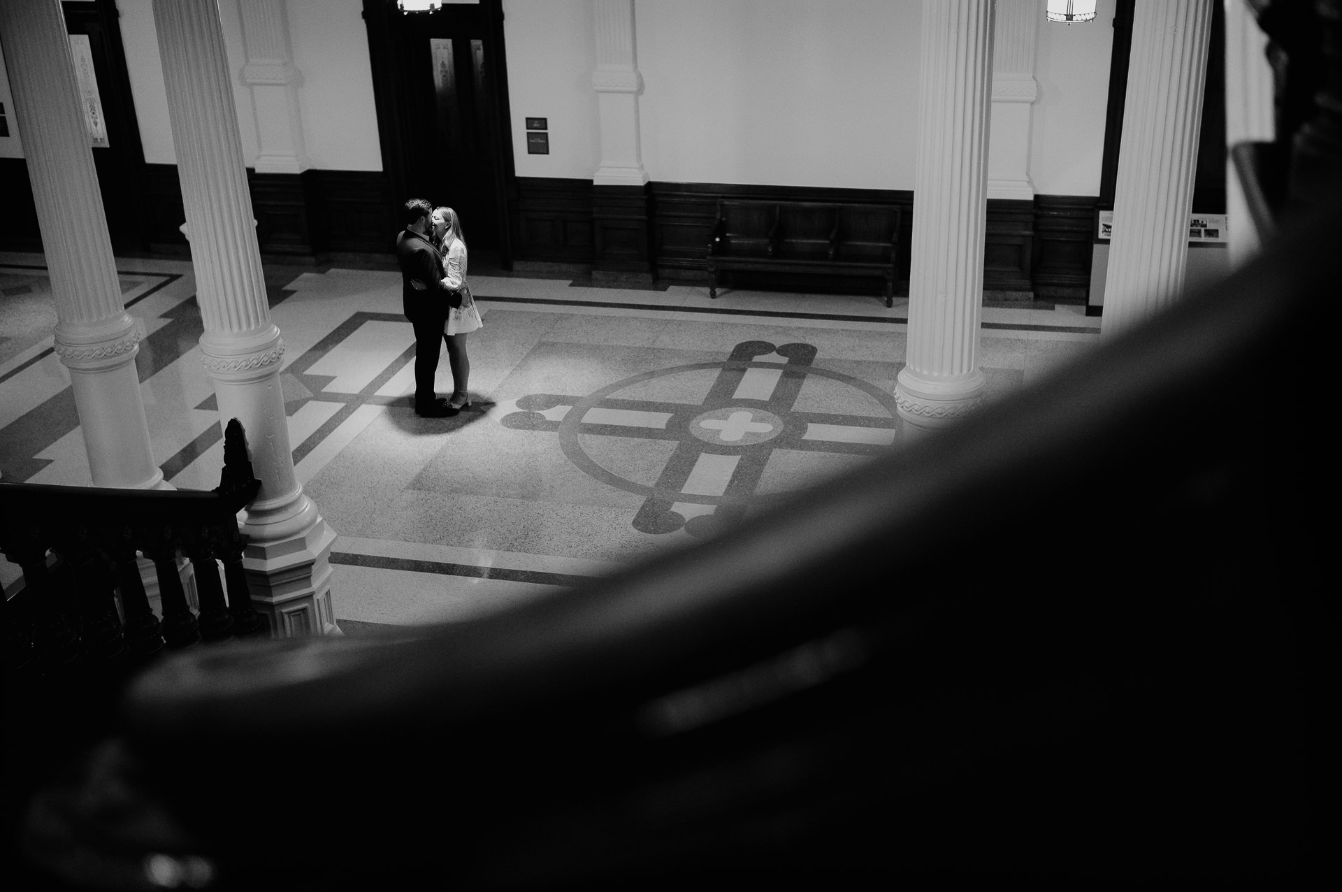 Engagement Session in the Texas State Capitol 10 Couple embracing in elegant setting.