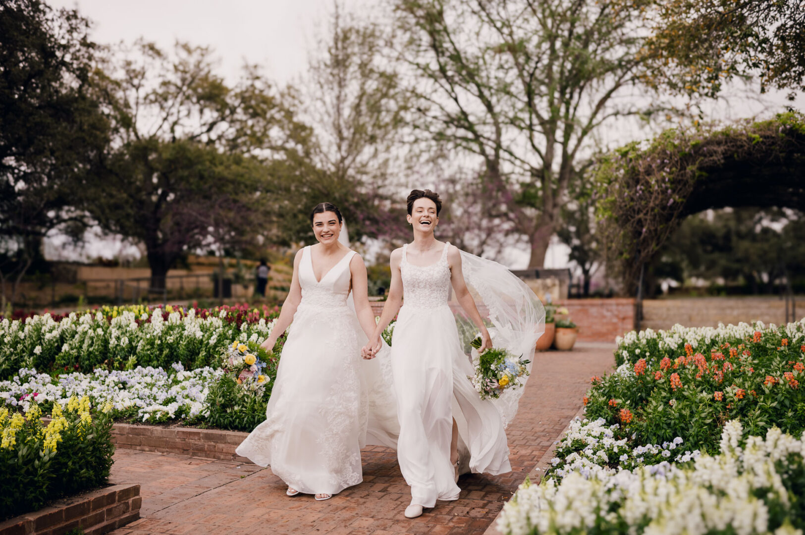 Winter Wedding at Botanical Gardens, San Antonio, Texas 37 Two brides walking in garden