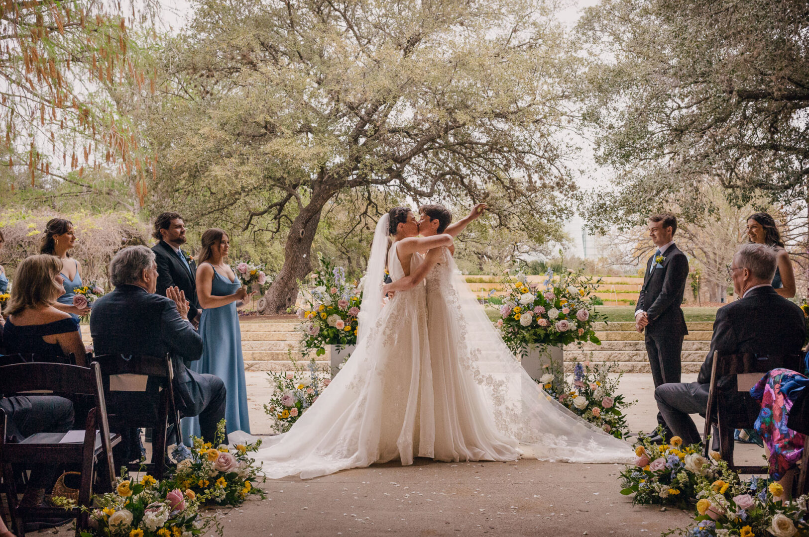 Winter Wedding at Botanical Gardens, San Antonio, Texas 26 Couple exchanging vows in garden setting.