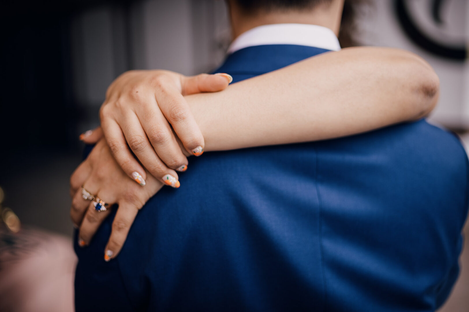 Couple embracing at wedding reception.
